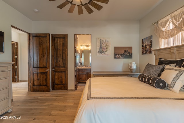 14332 E Bobwhite Way, Scottsdale, AZ 85262 - bedroom with light wood-style flooring, ensuite bathroom, and ceiling fan