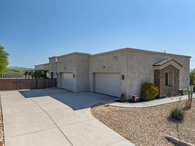 14332 E Bobwhite Way, Scottsdale, AZ 85262 - pueblo-style home featuring concrete driveway, stucco siding, and an attached garage