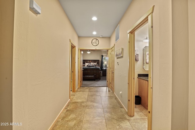 hallway featuring light tile patterned flooring