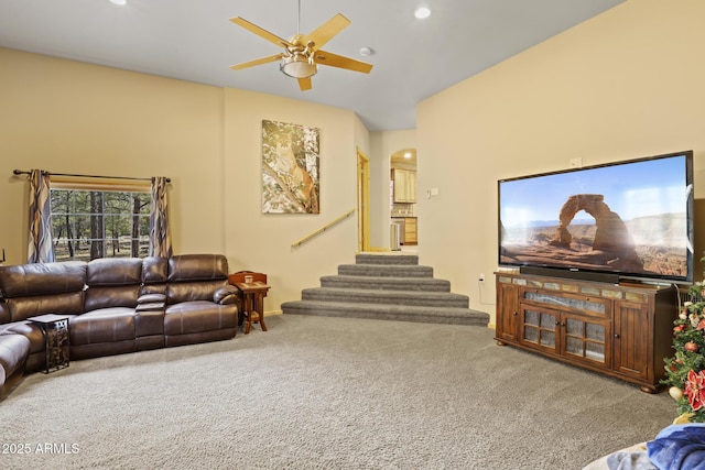 living room featuring carpet flooring and ceiling fan