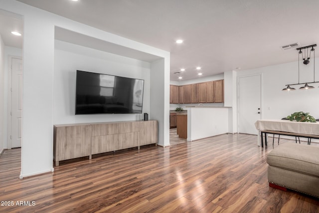 living room featuring recessed lighting, visible vents, and dark wood finished floors