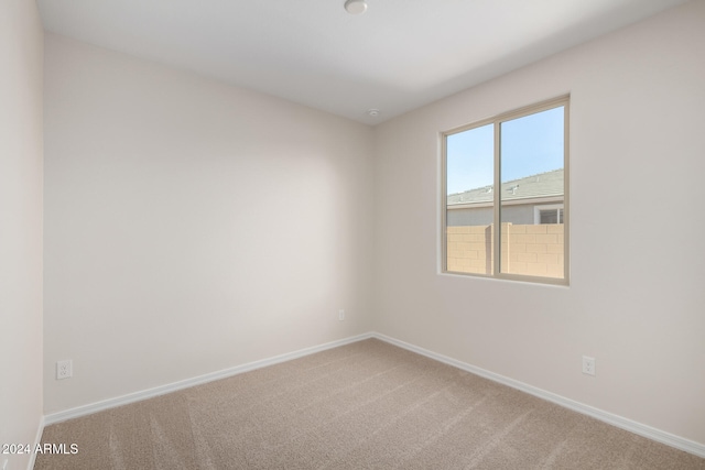 unfurnished room featuring carpet flooring