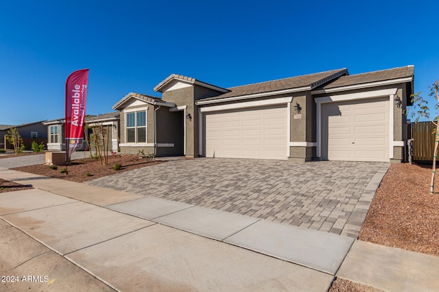 ranch-style house featuring a garage