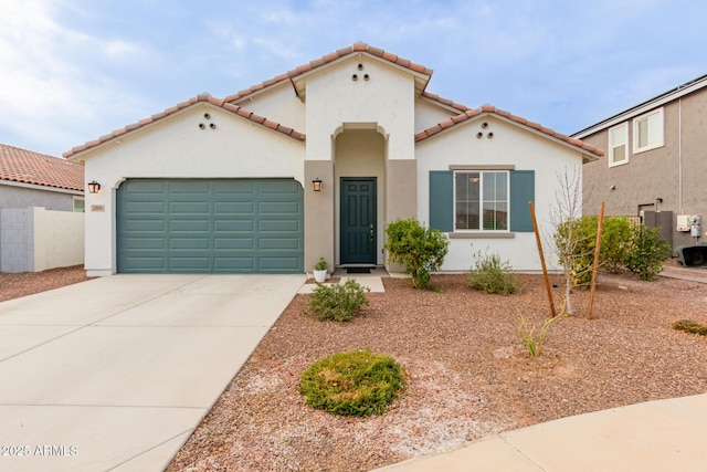 mediterranean / spanish-style home featuring a garage