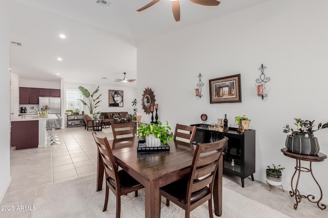 dining area featuring ceiling fan and light tile patterned floors
