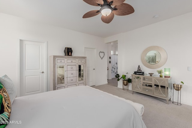 bedroom with ceiling fan and light colored carpet