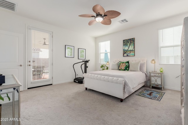 bedroom with ceiling fan, light carpet, and access to outside