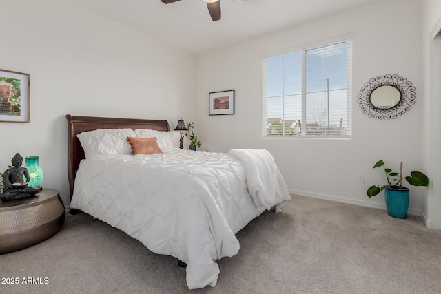 bedroom with ceiling fan and light colored carpet