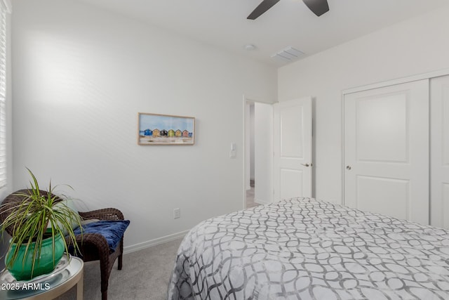 carpeted bedroom featuring ceiling fan and a closet