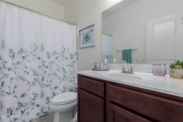bathroom featuring toilet, vanity, tile patterned floors, and walk in shower