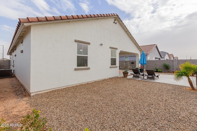back of house with a patio area