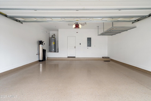 garage featuring water heater, a garage door opener, and electric panel