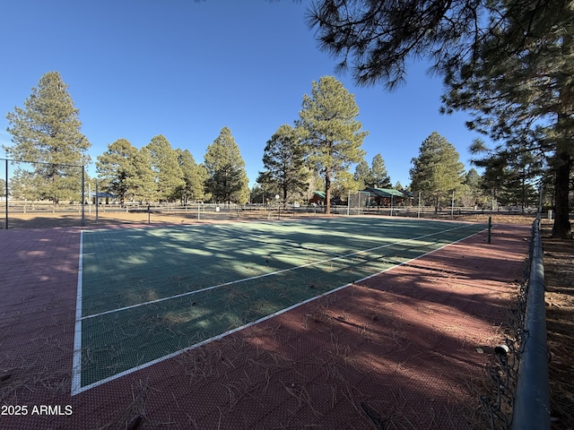 view of sport court with fence