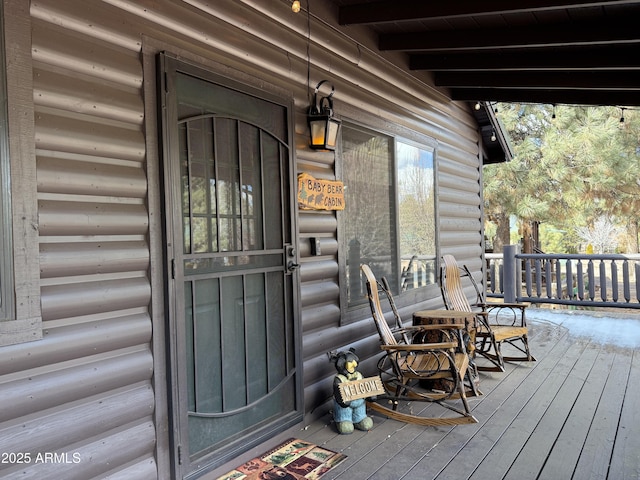 doorway to property with a porch