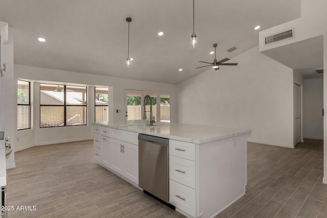 723 E Piute Ave, Phoenix, AZ 85024 - kitchen with stainless steel dishwasher, ceiling fan, lofted ceiling, white cabinetry, and light wood finished floors