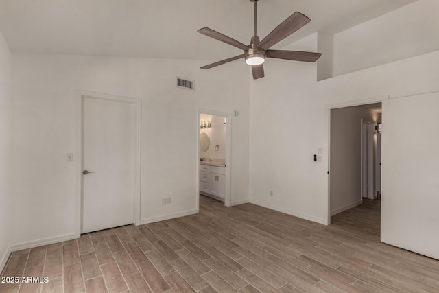 723 E Piute Ave, Phoenix, AZ 85024 - unfurnished bedroom with high vaulted ceiling, light wood-style floors, ensuite bath, and ceiling fan