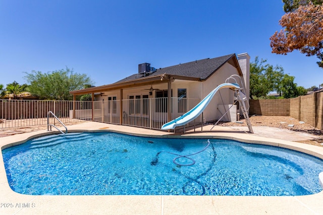 723 E Piute Ave, Phoenix, AZ 85024 - view of swimming pool featuring a water slide, ceiling fan, a fenced backyard, and a patio area