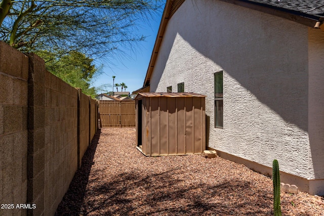 723 E Piute Ave, Phoenix, AZ 85024 - view of property exterior featuring a fenced backyard, stucco siding, and a storage unit