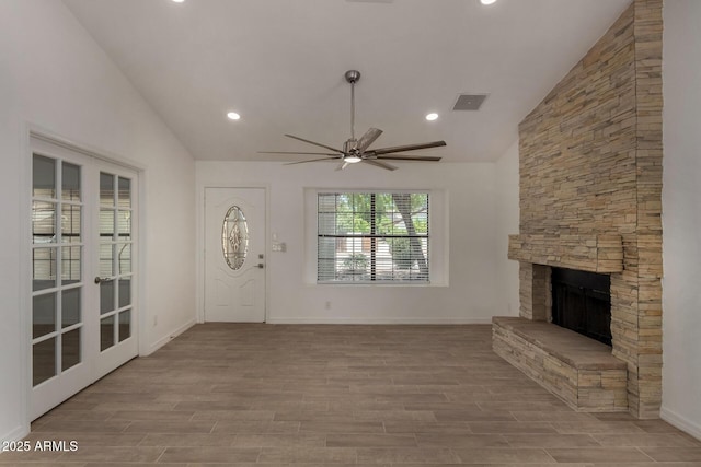 723 E Piute Ave, Phoenix, AZ 85024 - unfurnished living room with a stone fireplace, ceiling fan, wood finished floors, recessed lighting, and french doors