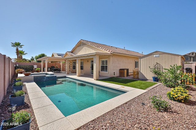 view of pool with a patio, a fenced backyard, a storage unit, and an outdoor structure
