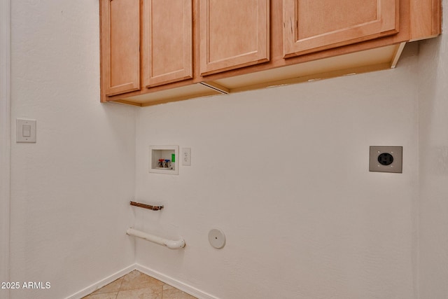clothes washing area featuring baseboards, cabinet space, gas dryer hookup, electric dryer hookup, and washer hookup