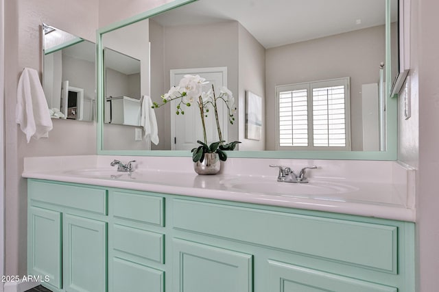 full bath featuring a sink and double vanity