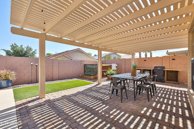 view of patio featuring a fenced backyard, a pergola, and outdoor dining area