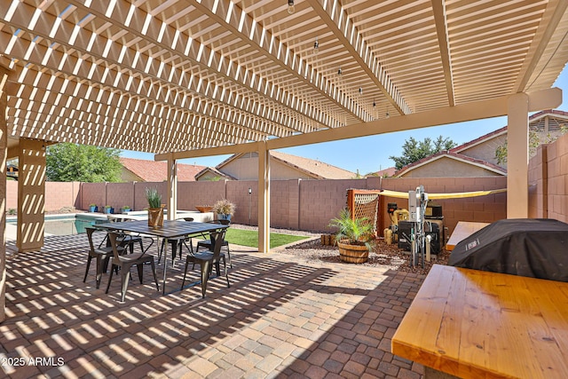 view of patio with grilling area, outdoor dining area, a fenced in pool, a fenced backyard, and a pergola