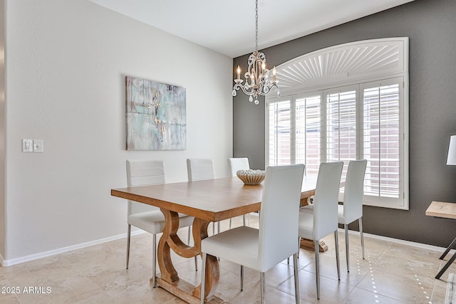 dining room with light tile patterned floors, baseboards, a chandelier, and a healthy amount of sunlight