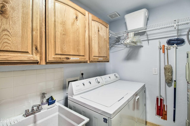 3047 Ponderosa Rd, Overgaard, AZ 85933 - laundry area featuring visible vents, washer and dryer, cabinet space, and a sink