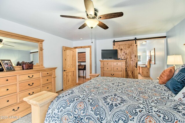 3047 Ponderosa Rd, Overgaard, AZ 85933 - bedroom with a barn door and ceiling fan
