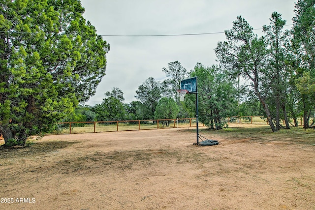 3047 Ponderosa Rd, Overgaard, AZ 85933 - view of yard featuring basketball hoop and fence