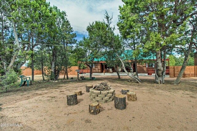 3047 Ponderosa Rd, Overgaard, AZ 85933 - view of playground with a fire pit and fence