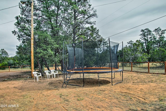 3047 Ponderosa Rd, Overgaard, AZ 85933 - view of yard with fence and a trampoline