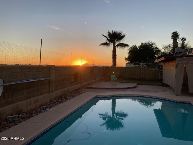 view of swimming pool featuring a fenced in pool, a patio, and a fenced backyard