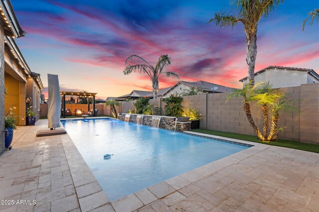 pool at dusk featuring a fenced in pool, a patio area, a pergola, and a fenced backyard