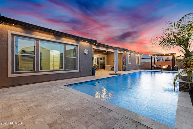 view of pool featuring a patio, a fenced in pool, fence, a pergola, and ceiling fan