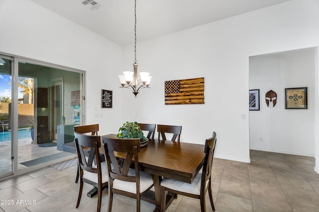 dining space featuring tile patterned flooring, baseboards, visible vents, and a chandelier