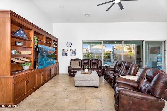 living room with visible vents and a ceiling fan