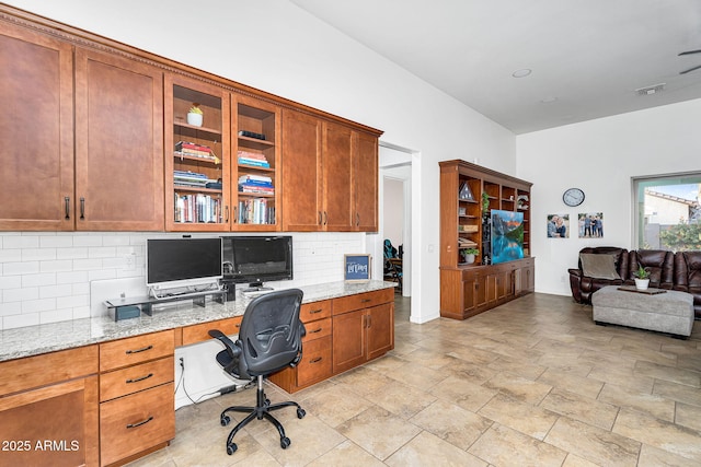 office area with visible vents and built in study area