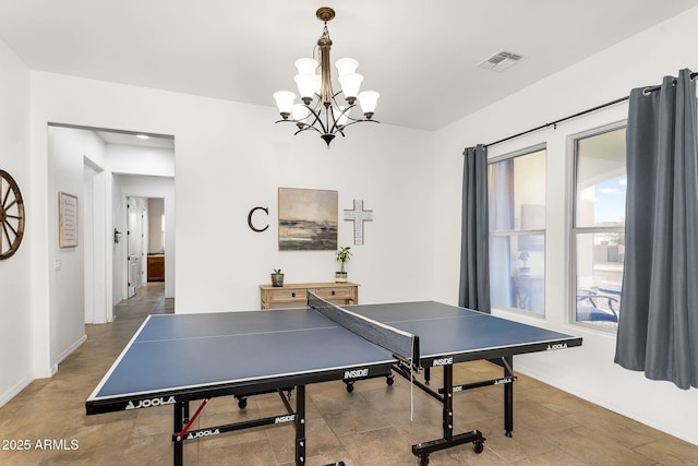 playroom featuring visible vents, baseboards, and an inviting chandelier