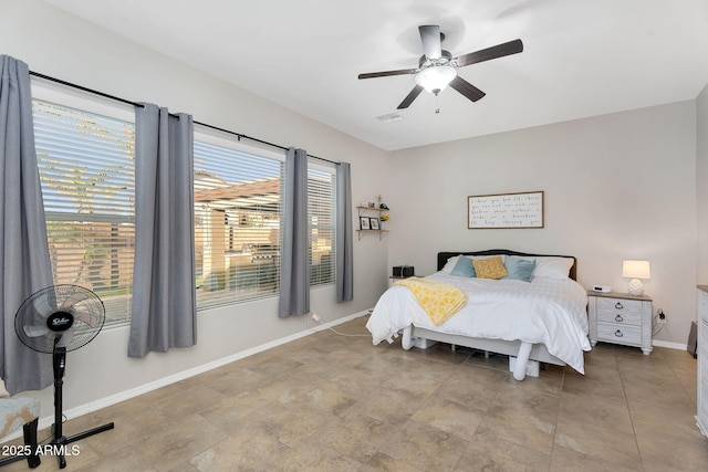 bedroom with visible vents, ceiling fan, and baseboards