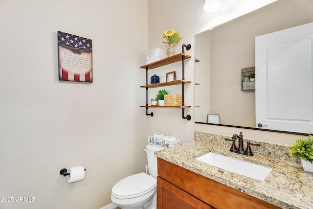 half bath with vanity and toilet