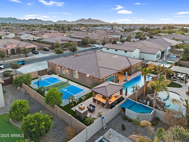 drone / aerial view with a mountain view and a residential view