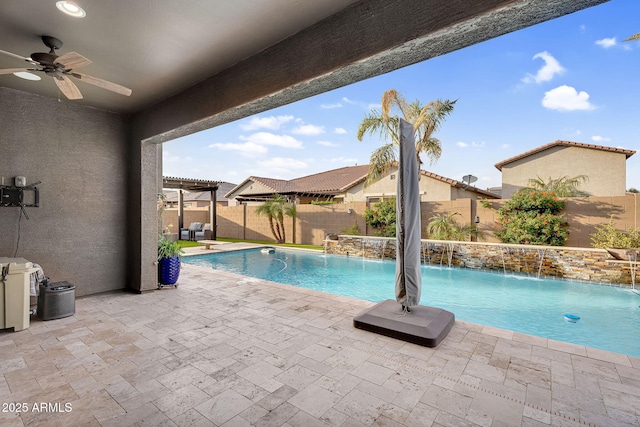 view of pool featuring a patio, a fenced backyard, a fenced in pool, and ceiling fan