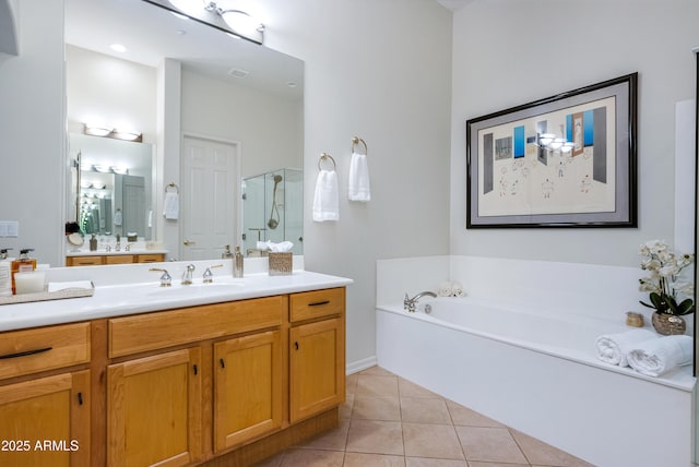 bathroom with separate shower and tub, vanity, and tile patterned floors