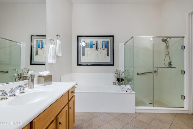 bathroom with independent shower and bath, tile patterned floors, and vanity