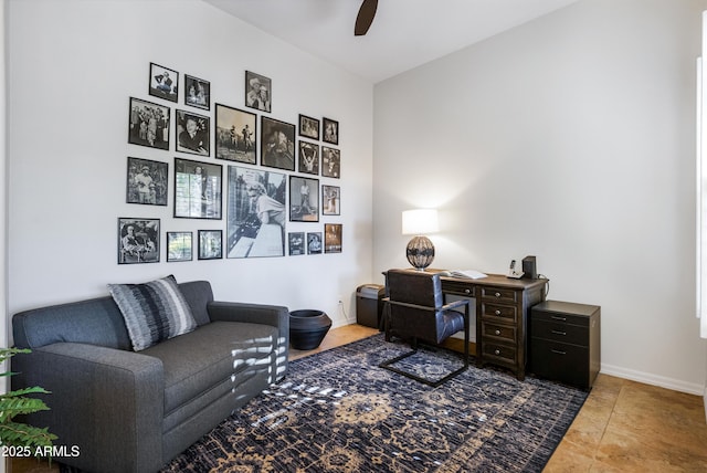 interior space with ceiling fan and tile patterned flooring