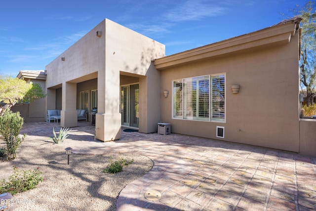 rear view of house with a patio