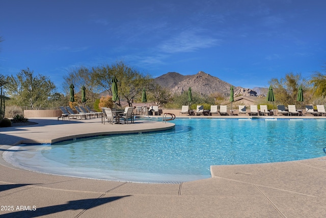 view of pool featuring a patio area and a mountain view